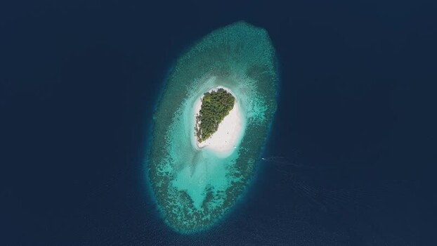 Aerial view of a tropical island and coral reef Maldives. Aerial view of a tropical island and coral reef Maldives.