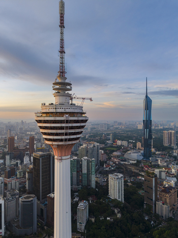Kuala Lumpur Malaysia 11 March 2026 Aerial view of the Kuala Lumpur Tower and Merdeka 118 skyscraper rising above the urban skyline during sunset.