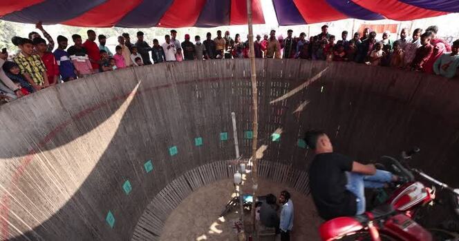 View of a motorcyclist performing in the Well of Death Bangladesh.