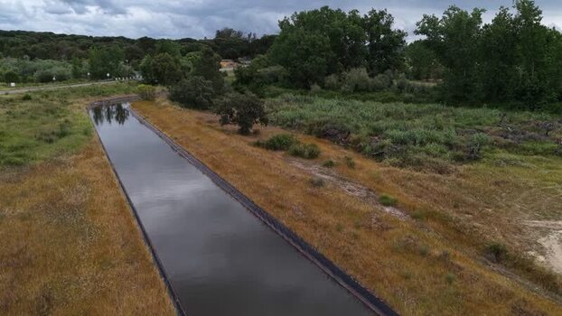 Aerial view of a water canal through rural fields Portugal. Aerial view of a water canal through rural fields Portugal.
