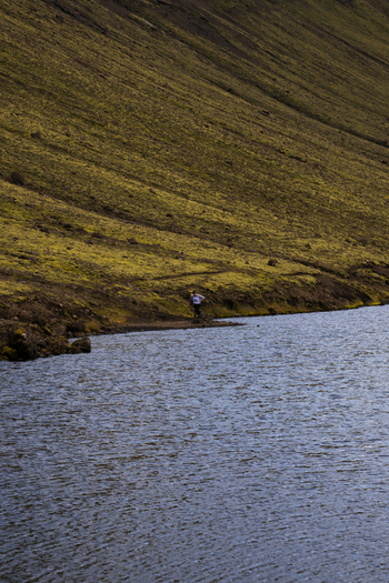View of placid waters reflecting the overcast sky nestled against a grassy slope in Skaftárhreppur Iceland Skaftárhreppur Iceland. View of placid waters reflecting the overcast sky nestled against a grassy slope in Skaftárhreppur Iceland Skaftárhreppur Iceland.