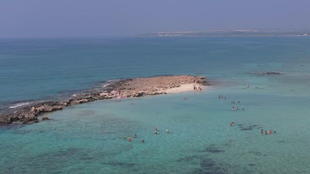 Aerial view of rocky island in turquoise water Northern Cyprus.