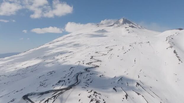 Aerial view of the snow covered Mount Etna and Rifugio Sapienza Italy. Aerial view of the snow covered Mount Etna and Rifugio Sapienza Italy.