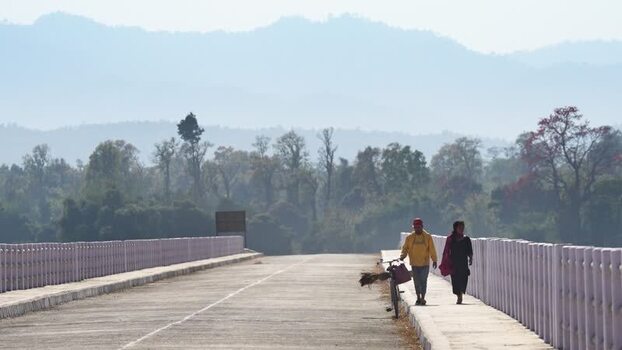 View of people walking on a bridge in Dhangadhi Nepal. View of people walking on a bridge in Dhangadhi Nepal.