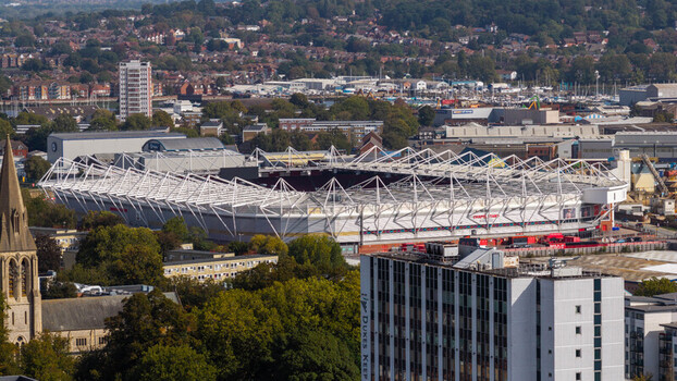 Aerial view of St Mary s Stadium surrounded by urban buildings and greenery in Southampton England United Kingdom. Aerial view of St Mary s Stadium surrounded by urban buildings and greenery in Southampton England United Kingdom.