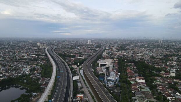Aerial view of the elevated highway and urban landscape in Bekasi Barat West Java Indonesia. Aerial view of the elevated highway and urban landscape in Bekasi Barat West Java Indonesia.
