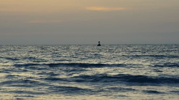 View of calm sea waves at sunset in Bangladesh. View of calm sea waves at sunset in Bangladesh.