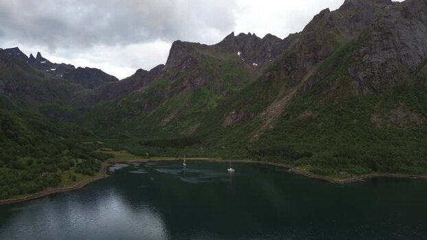 Aerial view of Senja fjord with sailboats in Norway.