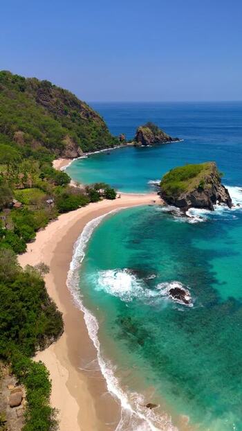 Aerial view of Koka Beach with turquoise water and rocky islets Indonesia. Aerial view of Koka Beach with turquoise water and rocky islets Indonesia.