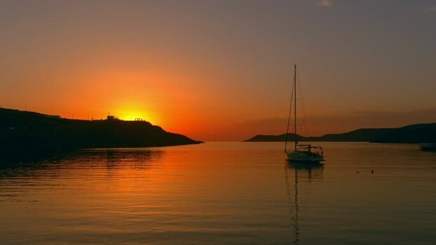 Aerial view of sailboat in bay at sunset Greece. Aerial view of sailboat in bay at sunset Greece.