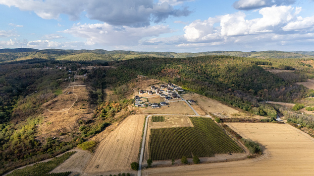 Aerial view of Ruza vetrova resort surrounded by vineyards rolling hills and lush forests in the rural landscape of Mala Remeta Vojvodina Serbia.