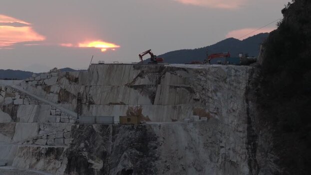 Aerial view of marble quarry at sunset in Carrara Italy. Aerial view of marble quarry at sunset in Carrara Italy.