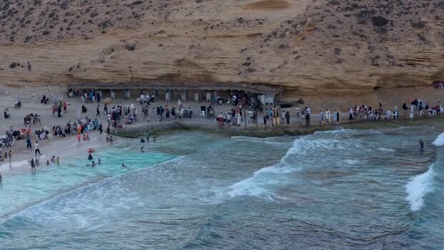 View of Ageeba Beach with people and waves Egypt. View of Ageeba Beach with people and waves Egypt.