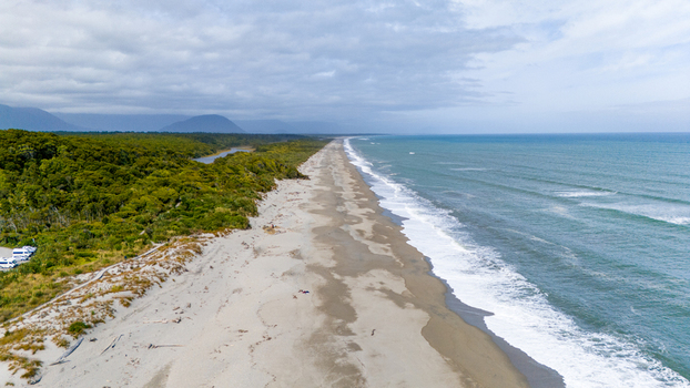 Aerial view of the rugged coastline where the forest meets the wild sea Ship Creek Haast West Coast Region New Zealand. Aerial view of the rugged coastline where the forest meets the wild sea Ship Creek Haast West Coast Region New Zealand.