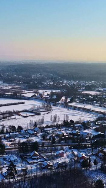 Aerial view of snowy rural landscape in Jelgava Municipality Latvia.