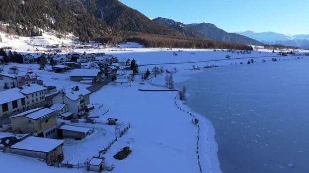 Aerial view of Graun im Vinschgau and frozen Reschensee Italy. Aerial view of Graun im Vinschgau and frozen Reschensee Italy.
