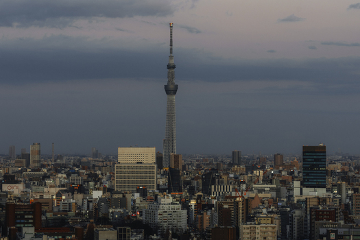 Aerial view of Tokyo Skytree piercing the skyline amidst a dense cityscape bathed in the soft hues of twilight Bunkyo City Tokyo Japan. Aerial view of Tokyo Skytree piercing the skyline amidst a dense cityscape bathed in the soft hues of twilight Bunkyo City Tokyo Japan.