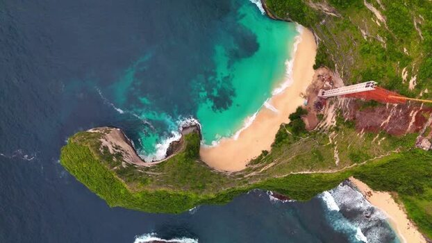 Aerial view of Kelingking Beach and turquoise ocean Indonesia. Aerial view of Kelingking Beach and turquoise ocean Indonesia.