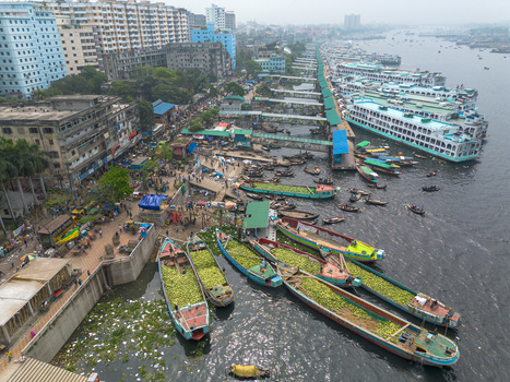 Dhaka Bangladesh 04 April 2026 Aerial view of the bustling Sadarghat area with ferries cargo boats and vibrant markets lining the Buriganga River. Dhaka Bangladesh 04 April 2026 Aerial view of the bustling Sadarghat area with ferries cargo boats and vibrant markets lining the Buriganga River.