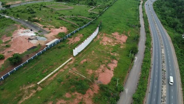 Aerial view of a highway and green fields in Nigeria.