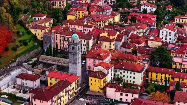 Aerial view of historic town with bell tower in Italy.