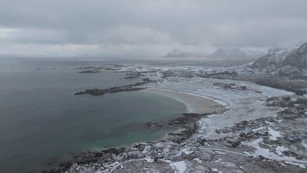 Aerial view of snowy Lofoten coastline Norway.
