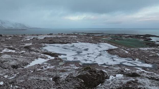 Aerial view of Lofoten landscape with frozen pond Norway.