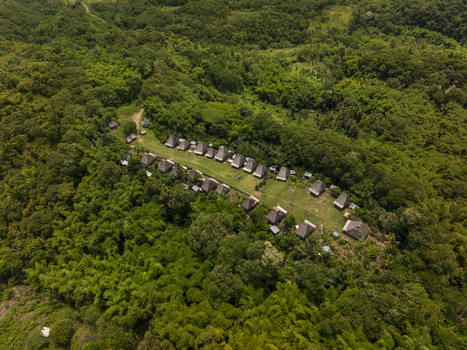 Aerial view of Kampung Adat Belaraghi a traditional village with thatched roof houses nestled in a lush green forest in Kecamatan Aimere Nusa Tenggara Timur Indonesia. Aerial view of Kampung Adat Belaraghi a traditional village with thatched roof houses nestled in a lush green forest in Kecamatan Aimere Nusa Tenggara Timur Indonesia.