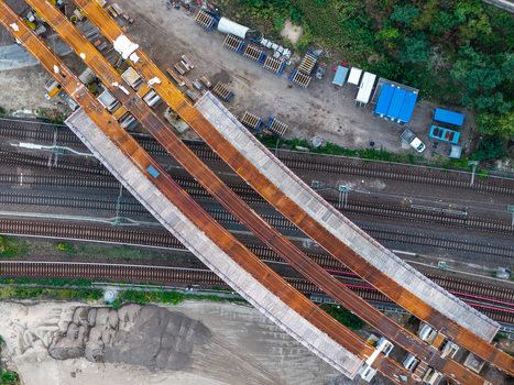 Aerial view of the Ringbahnbrucke bridge construction at the Funkturm interchange featuring steel girders railway tracks and construction site equipment in Berlin Berlin Germany. Aerial view of the Ringbahnbrucke bridge construction at the Funkturm interchange featuring steel girders railway tracks and construction site equipment in Berlin Berlin Germany.