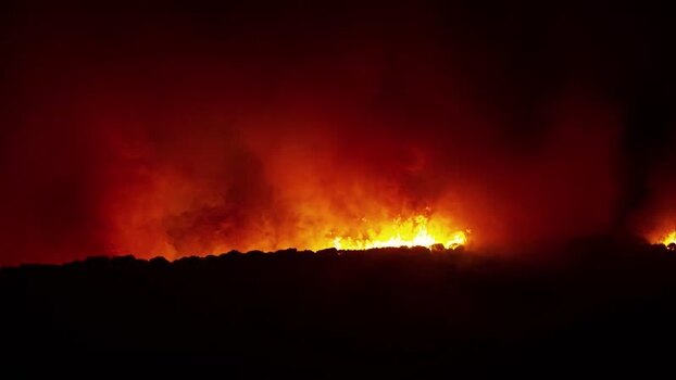 View of a nighttime wildfire in Spain.