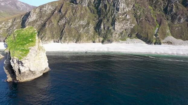 Aerial view of Glenlough Bay and sea stack in Ireland.