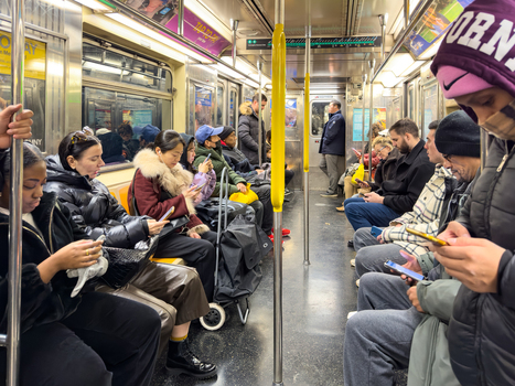 New York United States 14 May 2026 View of passengers sitting and standing inside a subway car many using their smartphones while commuting through the city. New York United States 14 May 2026 View of passengers sitting and standing inside a subway car many using their smartphones while commuting through the city.