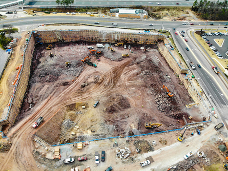 Reston United States 12 March 2019 Aerial view of a large construction site with heavy machinery excavators and earthmoving equipment in a cleared urban area. Reston United States 12 March 2019 Aerial view of a large construction site with heavy machinery excavators and earthmoving equipment in a cleared urban area.