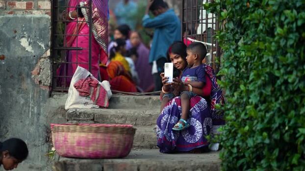 View of a woman taking a selfie with a child Bangladesh. View of a woman taking a selfie with a child Bangladesh.