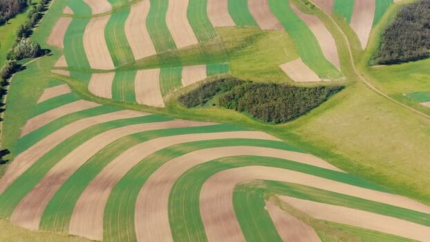Aerial view of striped agricultural fields Czechia.