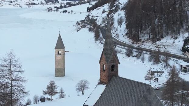 Aerial view of the sunken bell tower in Graun im Vinschgau Italy. Aerial view of the sunken bell tower in Graun im Vinschgau Italy.