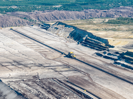 Aerial view of the Tagebau Welzow Sud brown coal open pit mine showing vast excavated landscape industrial conveyor systems and heavy machinery in Spremberg Brandenburg Germany. Aerial view of the Tagebau Welzow Sud brown coal open pit mine showing vast excavated landscape industrial conveyor systems and heavy machinery in Spremberg Brandenburg Germany.