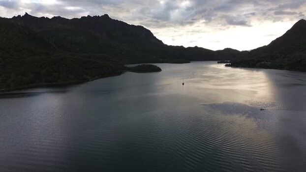 Aerial view of Senja fjord with mountains and boats Norway.