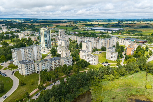 Aerial view of residential apartment blocks surrounded by lush green spaces and trees in Elektrenai Vilnius County Lithuania. Aerial view of residential apartment blocks surrounded by lush green spaces and trees in Elektrenai Vilnius County Lithuania.