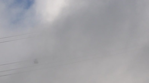 Aerial view of a cable car in thick clouds in Brazil. Aerial view of a cable car in thick clouds in Brazil.