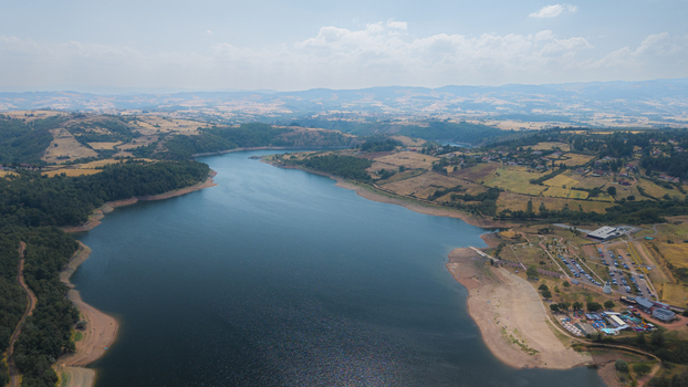 Aerial view of Barrage de Villerest showing the reservoir rolling hills forests and recreational area in Commelle Vernay Auvergne Rhone Alpes France. Aerial view of Barrage de Villerest showing the reservoir rolling hills forests and recreational area in Commelle Vernay Auvergne Rhone Alpes France.