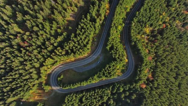 Aerial view of winding road in Transylvania Romania.