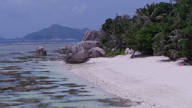 Aerial view of Anse Reunion beach with granite boulders Seychelles.