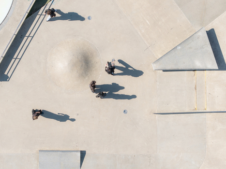Vilnius Lithuania 20 April 2026 Aerial view of Chiune Sugihara Sakura Park featuring skateboarders on concrete ramps and obstacles with long shadows cast on the ground. Vilnius Lithuania 20 April 2026 Aerial view of Chiune Sugihara Sakura Park featuring skateboarders on concrete ramps and obstacles with long shadows cast on the ground.