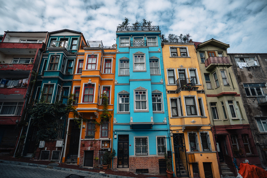 Istanbul Turkiye 06 October 2019 View of vibrant houses in Balat their colorful facades standing in stark contrast against the overcast sky. Istanbul Turkiye 06 October 2019 View of vibrant houses in Balat their colorful facades standing in stark contrast against the overcast sky.