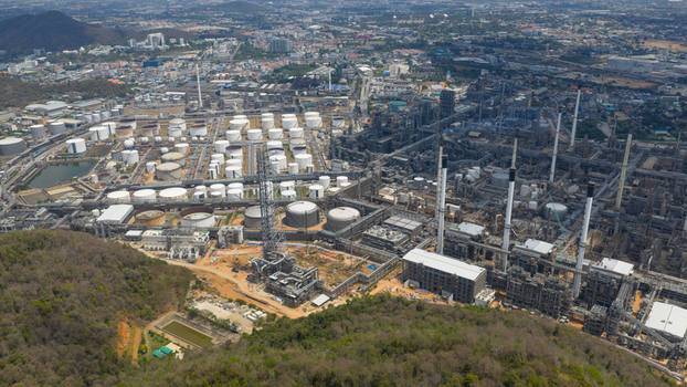 Aerial view of the Eastern Economic Corridor of Innovation EECi industrial complex with storage tanks and chimneys in Tambon Pa Yup Nai Chang Wat Rayong Thailand. Aerial view of the Eastern Economic Corridor of Innovation EECi industrial complex with storage tanks and chimneys in Tambon Pa Yup Nai Chang Wat Rayong Thailand.