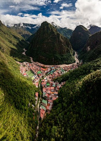 Aerial view of the Urubamba River winding through the lush jungle landscape surrounding the town of Aguas Calientes Cusco Peru. Aerial view of the Urubamba River winding through the lush jungle landscape surrounding the town of Aguas Calientes Cusco Peru.