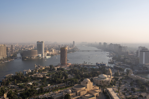 Cairo Egypt 19 October 2025 View of the Nile River flowing through the city with the Cairo Tower and modern buildings contrasting against a hazy skyline. Cairo Egypt 19 October 2025 View of the Nile River flowing through the city with the Cairo Tower and modern buildings contrasting against a hazy skyline.