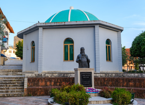View of the Bektashi Teqe with its turquoise dome and the bronze bust of Ahmet Myftar Dede Baba in Kruje Durres County Albania.