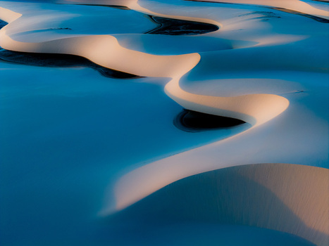 Aerial view of the white sand dunes and turquoise lagoons of Parque Nacional dos Lencois Maranhenses under soft light Lencois Maranhenses MA Brazil. Aerial view of the white sand dunes and turquoise lagoons of Parque Nacional dos Lencois Maranhenses under soft light Lencois Maranhenses MA Brazil.